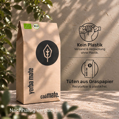 caámate Yerba Mate in einer braunen Papierverpackung mit Blattlogo.
